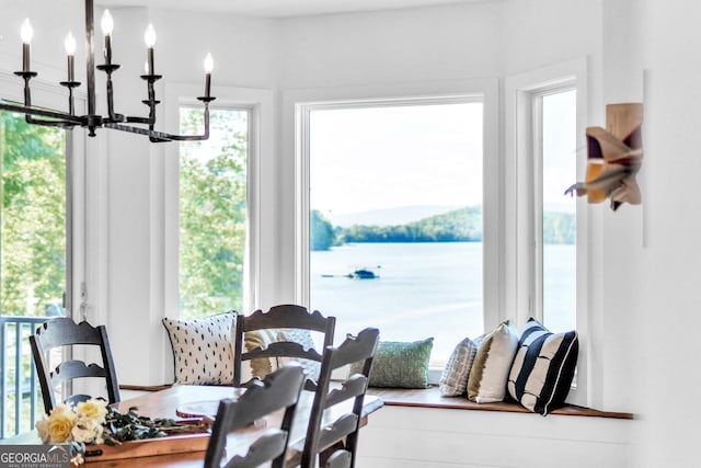 703 Cherokee Hls, Hiawassee, GA 30546 - dining space with a water view and a notable chandelier