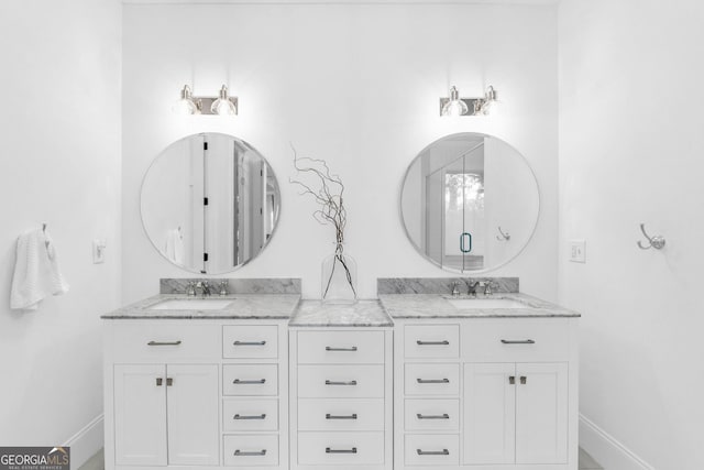 703 Cherokee Hls, Hiawassee, GA 30546 - full bathroom with a sink, double vanity, and baseboards