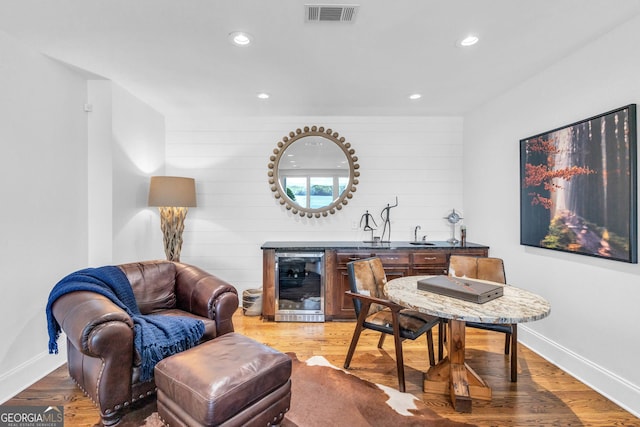 703 Cherokee Hls, Hiawassee, GA 30546 - living area with light wood-style flooring, visible vents, and beverage cooler