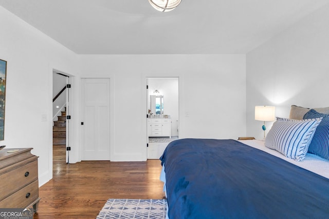 703 Cherokee Hls, Hiawassee, GA 30546 - bedroom featuring ensuite bath and wood finished floors