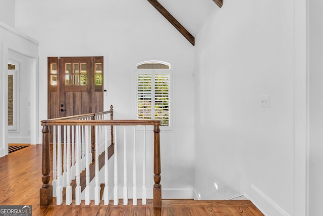 703 Cherokee Hls, Hiawassee, GA 30546 - stairs with wood finished floors, baseboards, and vaulted ceiling with beams