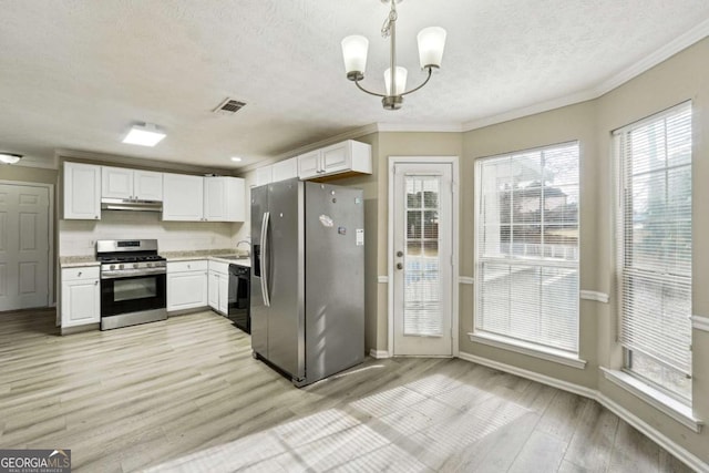 360 Wynbrook Dr, Mcdonough, GA 30253 - kitchen with a textured ceiling, visible vents, appliances with stainless steel finishes, white cabinets, and under cabinet range hood