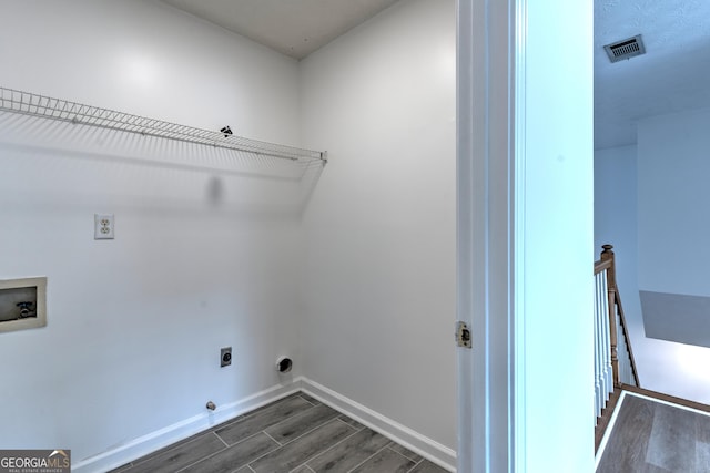 washroom with laundry area, hookup for a washing machine, hookup for an electric dryer, visible vents, and dark wood-style floors