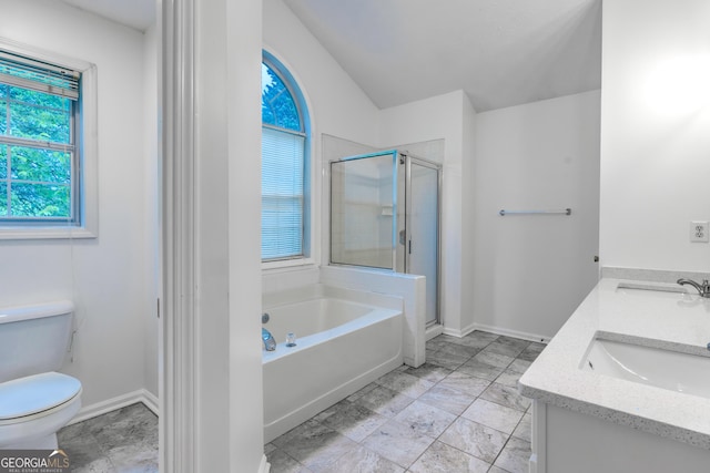 full bathroom with toilet, a sink, a garden tub, and a stall shower