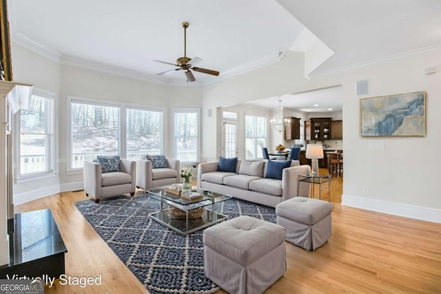 198 Grandmar Chase, Canton, GA 30115 - living room with crown molding, visible vents, baseboards, light wood-style floors, and ceiling fan with notable chandelier