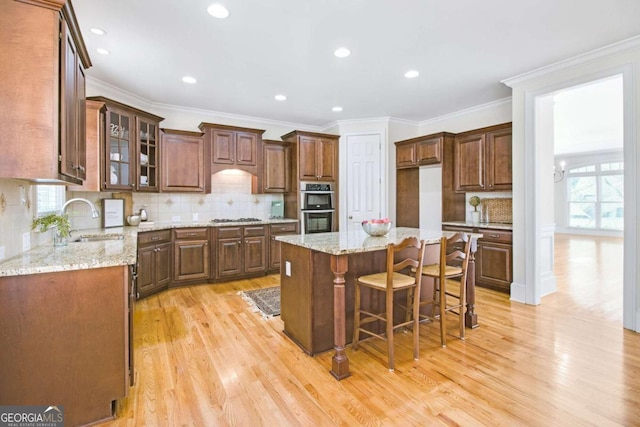 198 Grandmar Chase, Canton, GA 30115 - kitchen with stainless steel appliances, plenty of natural light, a sink, and light wood-style flooring