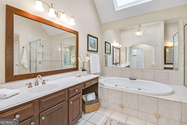 198 Grandmar Chase, Canton, GA 30115 - bathroom with a jetted tub, lofted ceiling with skylight, ornate columns, tile patterned floors, and a stall shower