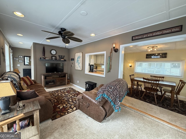 living area with a healthy amount of sunlight, carpet, a ceiling fan, and recessed lighting