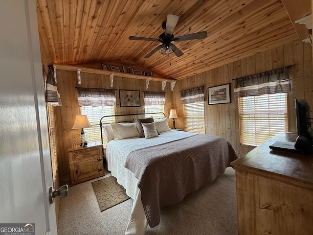 bedroom featuring carpet flooring, wood walls, wood ceiling, and lofted ceiling