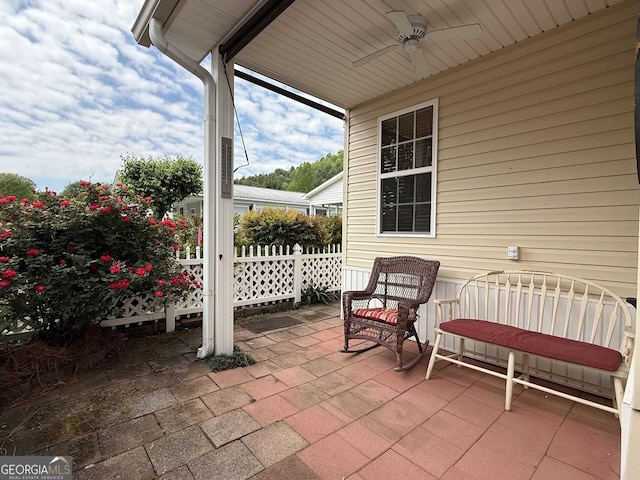 view of patio featuring ceiling fan