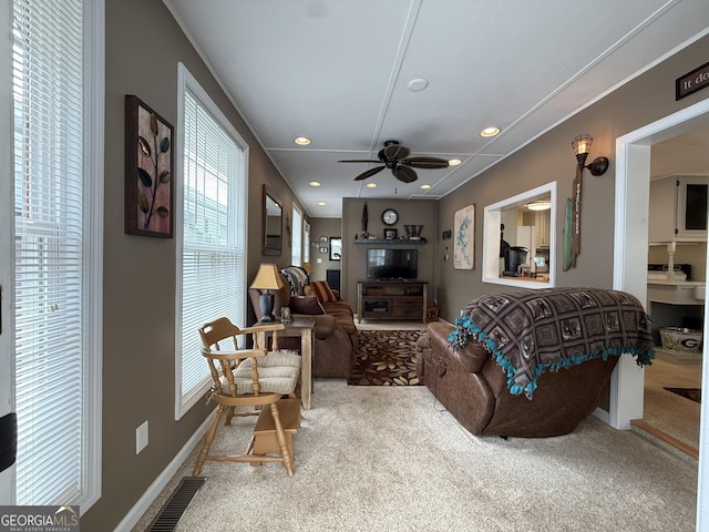 living area featuring visible vents, recessed lighting, carpet, and ceiling fan