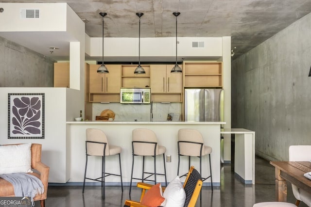 kitchen with visible vents, finished concrete flooring, and appliances with stainless steel finishes