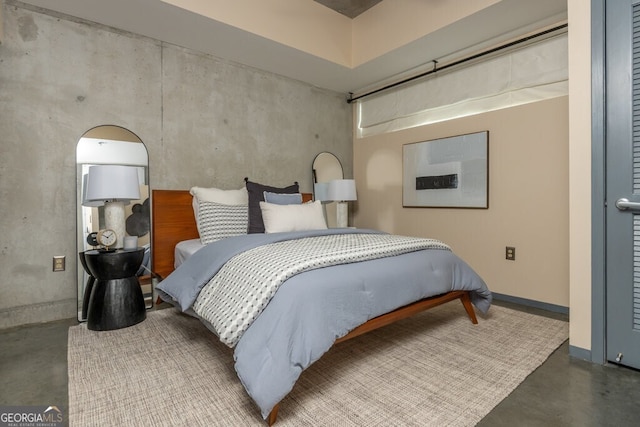 bedroom with concrete floors