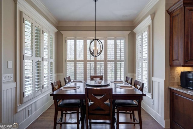 431 Tralee Ct, Statham, GA 30666 - dining room with a decorative wall, wainscoting, plenty of natural light, dark wood-style floors, and crown molding