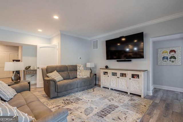 431 Tralee Ct, Statham, GA 30666 - living area featuring crown molding, wood finished floors, and recessed lighting