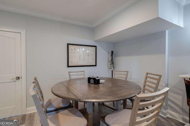 431 Tralee Ct, Statham, GA 30666 - dining area featuring wood finished floors and crown molding