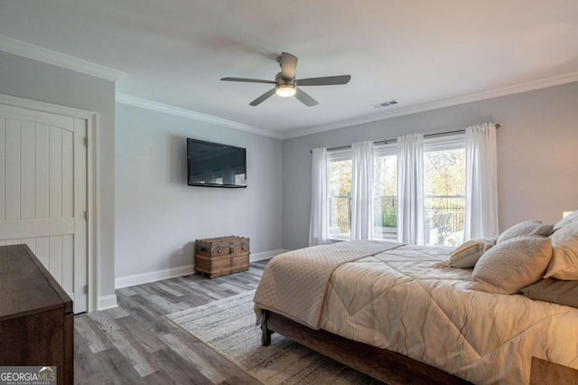 431 Tralee Ct, Statham, GA 30666 - bedroom featuring wood finished floors, ornamental molding, and ceiling fan