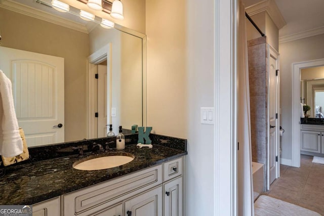 431 Tralee Ct, Statham, GA 30666 - bathroom featuring vanity, ornamental molding, tile patterned flooring, and bathing tub / shower combination