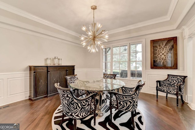 1898 Sam Snead Dr, Braselton, GA 30517 - dining area with an inviting chandelier, dark wood-style flooring, a decorative wall, and a wainscoted wall