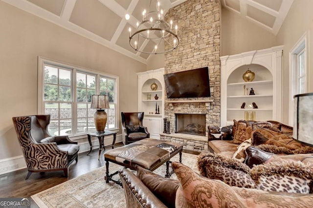 1898 Sam Snead Dr, Braselton, GA 30517 - living room with high vaulted ceiling, beamed ceiling, a stone fireplace, and wood finished floors