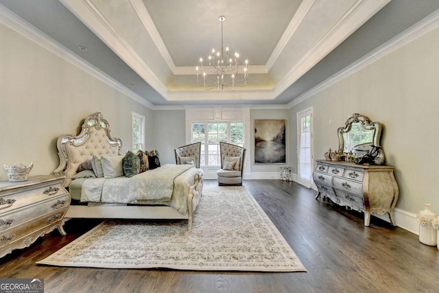 1898 Sam Snead Dr, Braselton, GA 30517 - bedroom featuring an inviting chandelier, ornamental molding, wood finished floors, and a tray ceiling