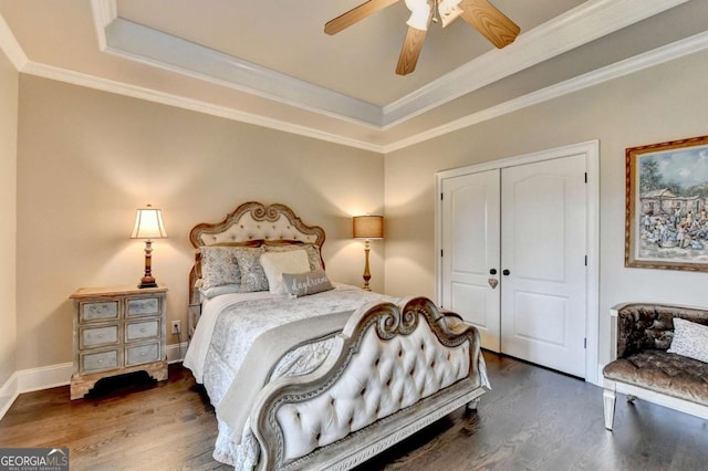 1898 Sam Snead Dr, Braselton, GA 30517 - bedroom with ceiling fan, wood finished floors, a raised ceiling, a closet, and ornamental molding
