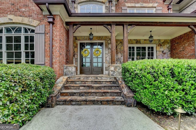 1898 Sam Snead Dr, Braselton, GA 30517 - view of exterior entry with a porch, french doors, and brick siding