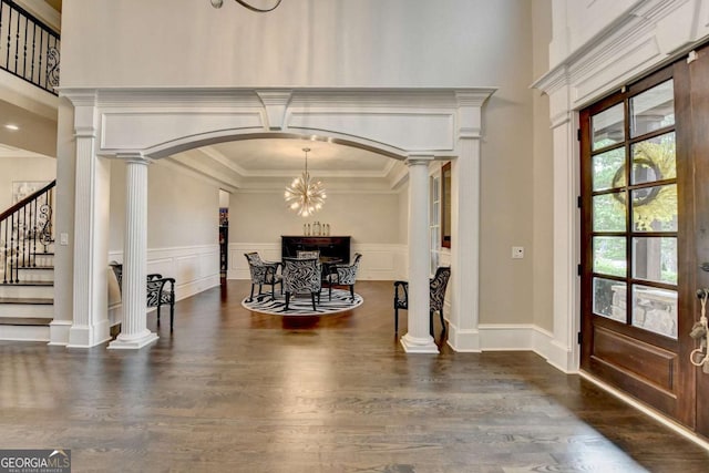 1898 Sam Snead Dr, Braselton, GA 30517 - foyer featuring ornate columns, stairs, and dark wood-type flooring