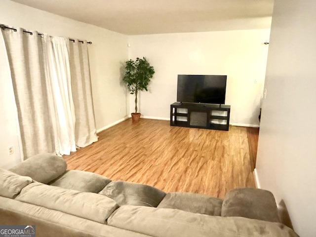 1448 Pine Log Rd NE Unit C, Conyers, GA 30012 - living room with wood finished floors and baseboards
