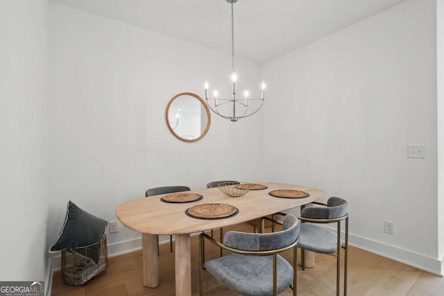230 New St Unit 2102, Decatur, GA 30030 - dining area featuring a chandelier and light wood finished floors