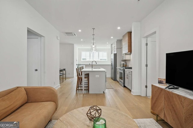 230 New St Unit 2102, Decatur, GA 30030 - living room with light wood-style flooring and recessed lighting