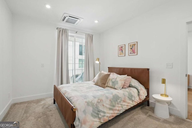 230 New St Unit 2102, Decatur, GA 30030 - bedroom with light carpet, recessed lighting, and access to exterior