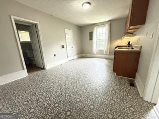 interior space featuring baseboards