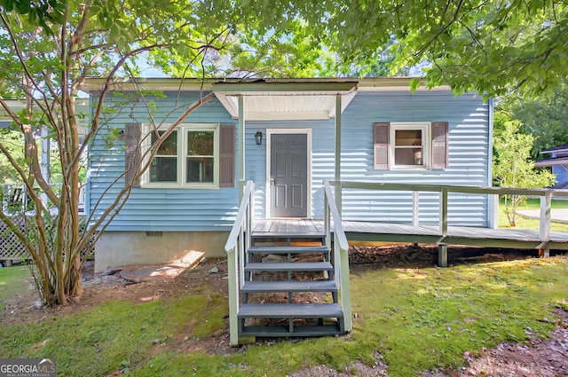 100 Tanglewood Rd, Eatonton, GA 31024 - bungalow-style home featuring a wooden deck and crawl space