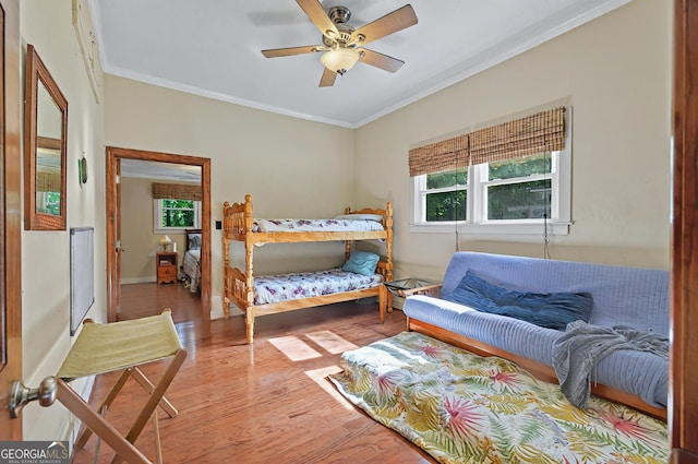 100 Tanglewood Rd, Eatonton, GA 31024 - bedroom featuring baseboards, ornamental molding, and wood-type flooring