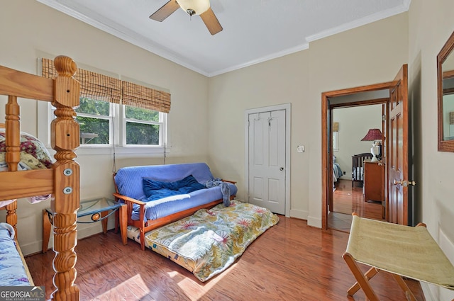 100 Tanglewood Rd, Eatonton, GA 31024 - bedroom featuring baseboards, ornamental molding, a ceiling fan, and wood finished floors