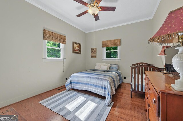 100 Tanglewood Rd, Eatonton, GA 31024 - bedroom with crown molding, baseboards, ceiling fan, and wood finished floors