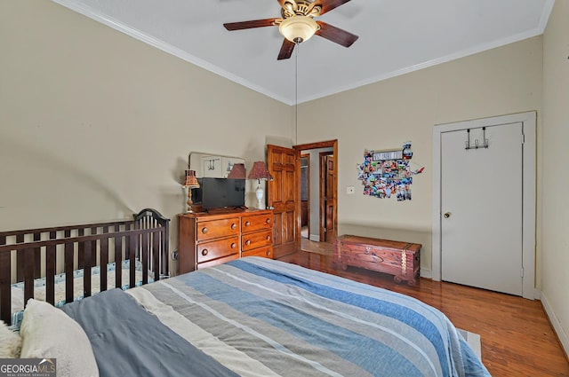 100 Tanglewood Rd, Eatonton, GA 31024 - bedroom with crown molding, baseboards, ceiling fan, and wood finished floors