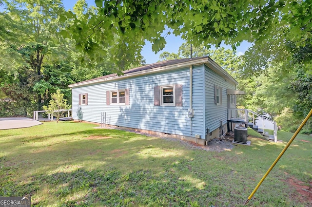 100 Tanglewood Rd, Eatonton, GA 31024 - rear view of house with a lawn