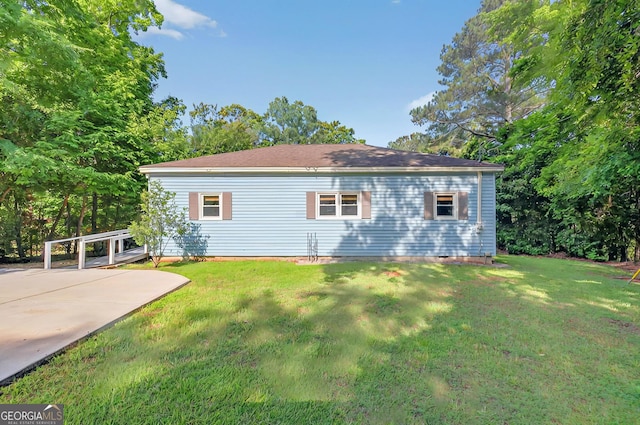 100 Tanglewood Rd, Eatonton, GA 31024 - rear view of house with a lawn
