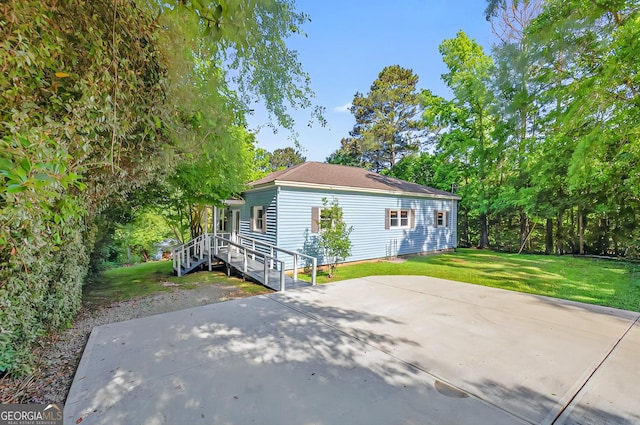100 Tanglewood Rd, Eatonton, GA 31024 - back of property featuring a patio and a yard