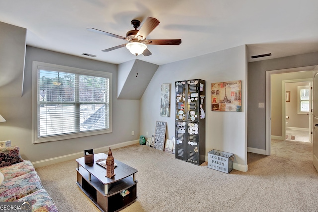 living room with visible vents, plenty of natural light, ceiling fan, and carpet floors