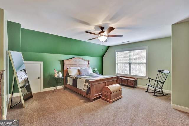 bedroom with carpet flooring, baseboards, visible vents, and lofted ceiling