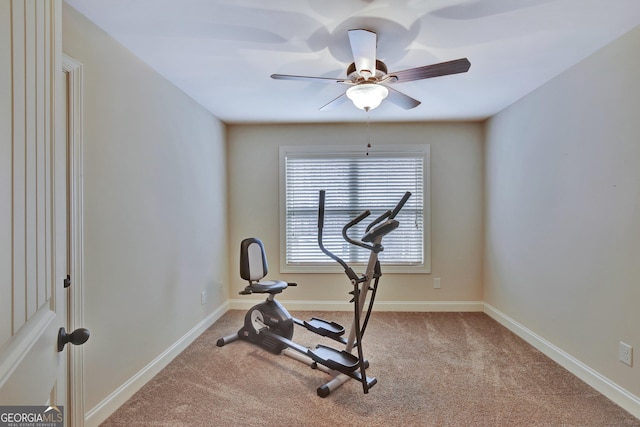 workout area featuring carpet floors, baseboards, and a ceiling fan