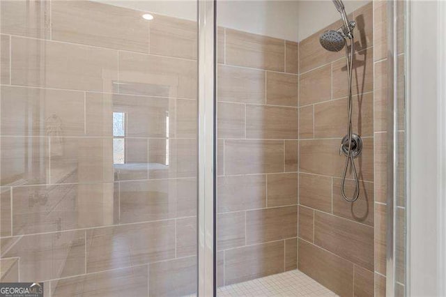 bathroom featuring a shower stall