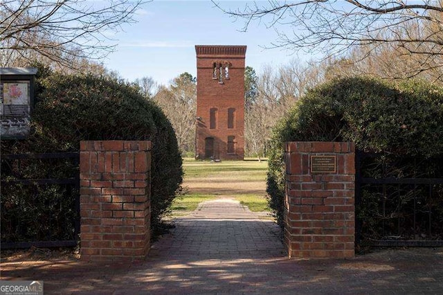 view of gate featuring fence