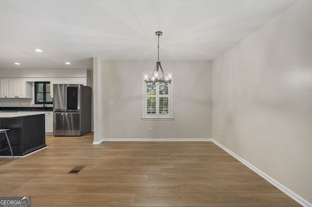 3813 Wingate Dr, Columbus, GA 31909 - unfurnished dining area with baseboards, light wood finished floors, and recessed lighting
