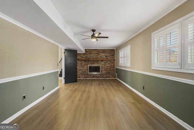 3813 Wingate Dr, Columbus, GA 31909 - unfurnished living room featuring baseboards, a ceiling fan, a brick fireplace, and wood finished floors