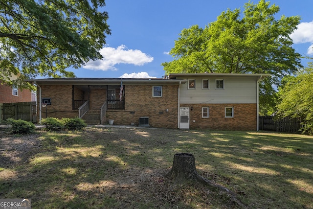 3813 Wingate Dr, Columbus, GA 31909 - rear view of house with fence, a yard, and brick siding