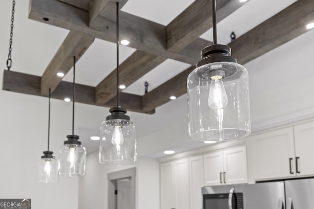 room details with white cabinetry and beam ceiling